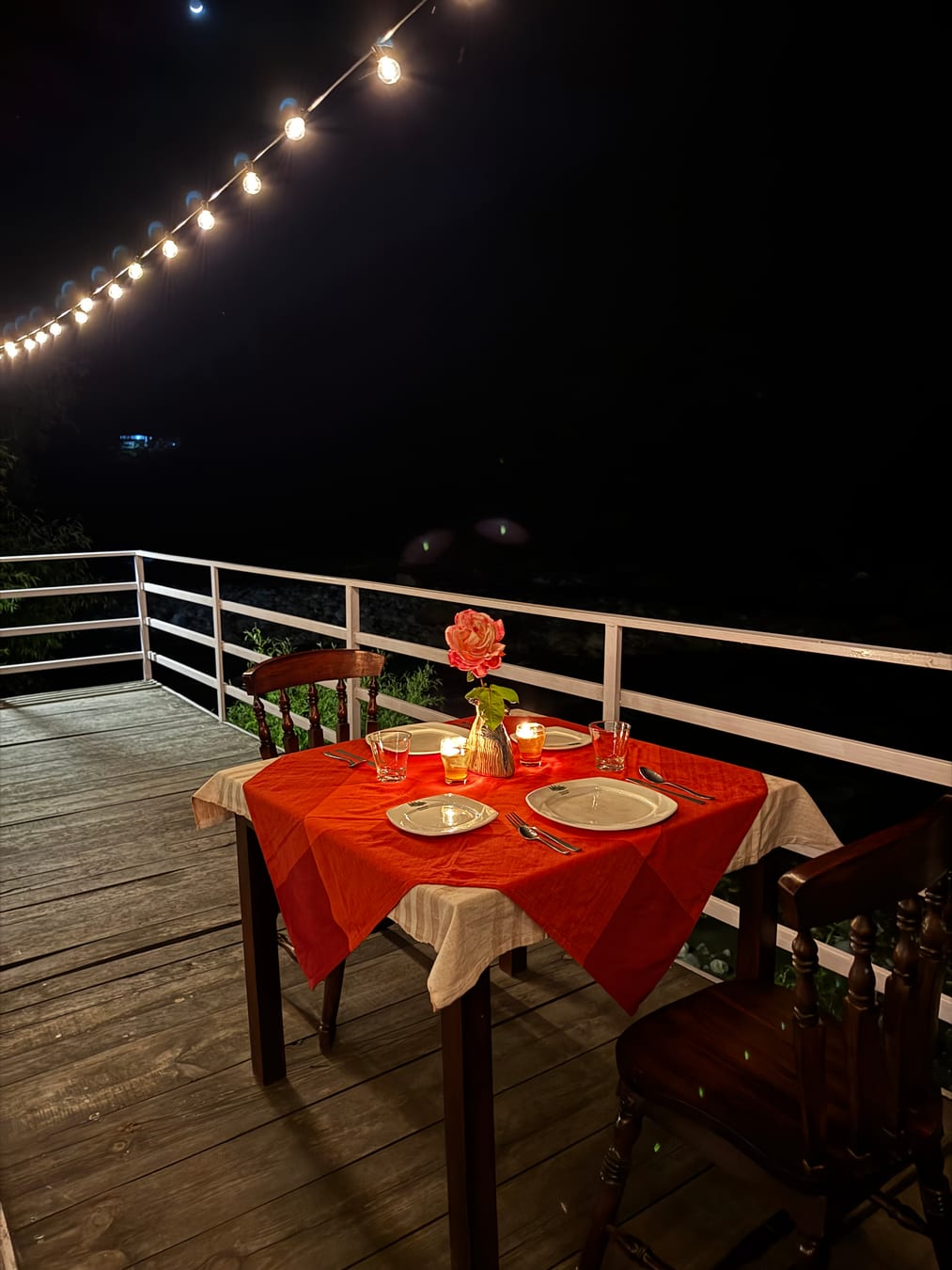 Private romantic riverside dinner setup at WhiteStone Cottages